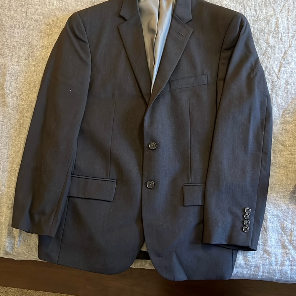 Black suit/ used once. Looks like a dark gray. Great quality. Modern fit